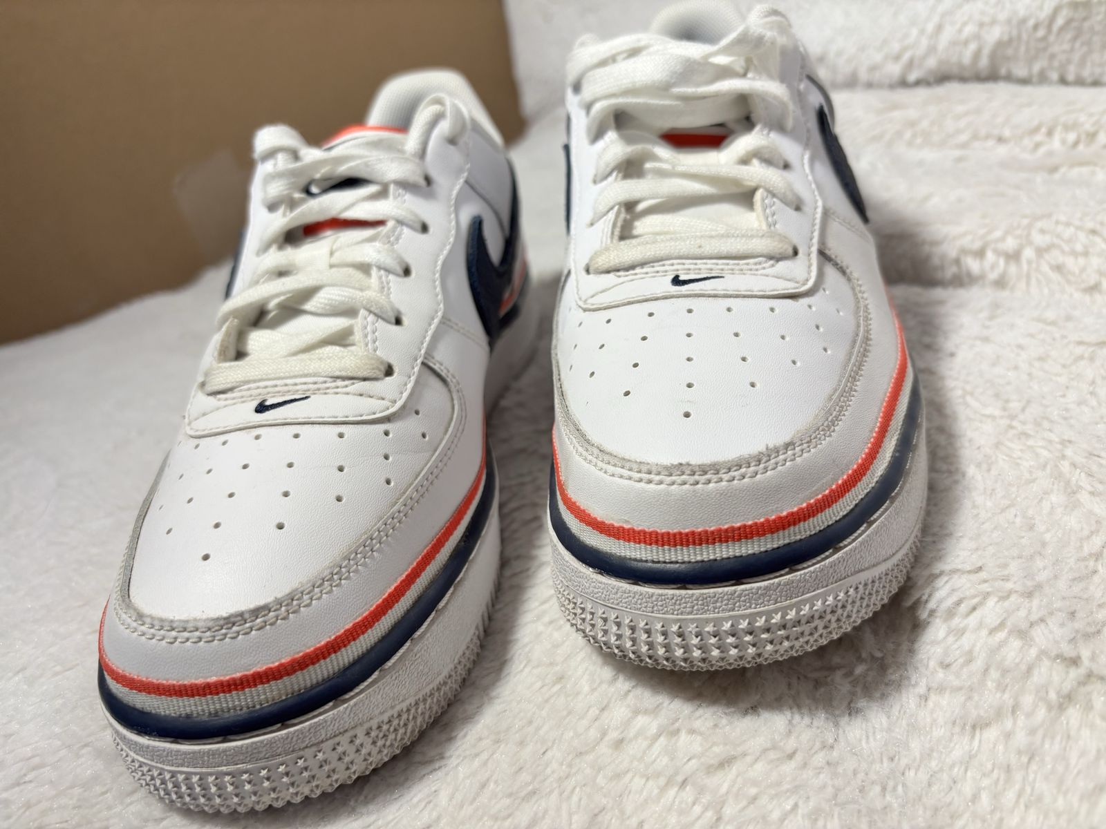 Nike air force 1 low top; lace up athletic sneakers