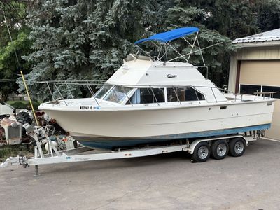 28’ Carver PleasureCraft, fly bridge, dual mercruiser, swim deck.