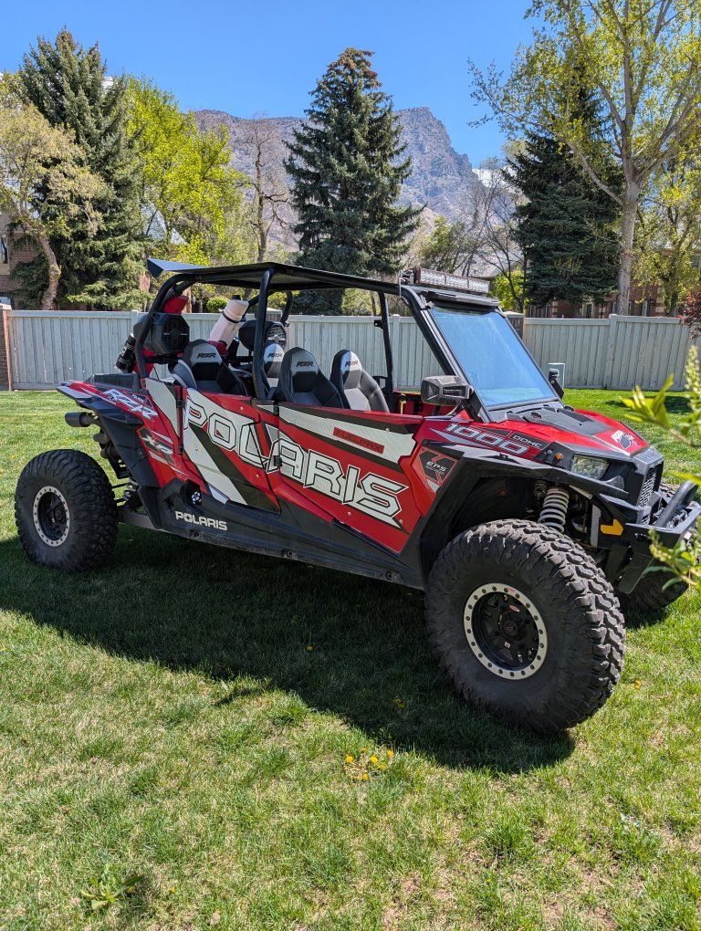 Polaris RZR XP 1000 Red/White UTV Side-by-Side - Race-Ready, Off-Road Adventure
