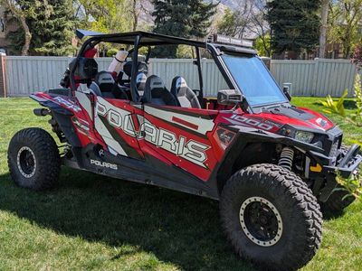 Polaris RZR XP 1000 Red/White UTV Side-by-Side - Race-Ready, Off-Road Adventure
