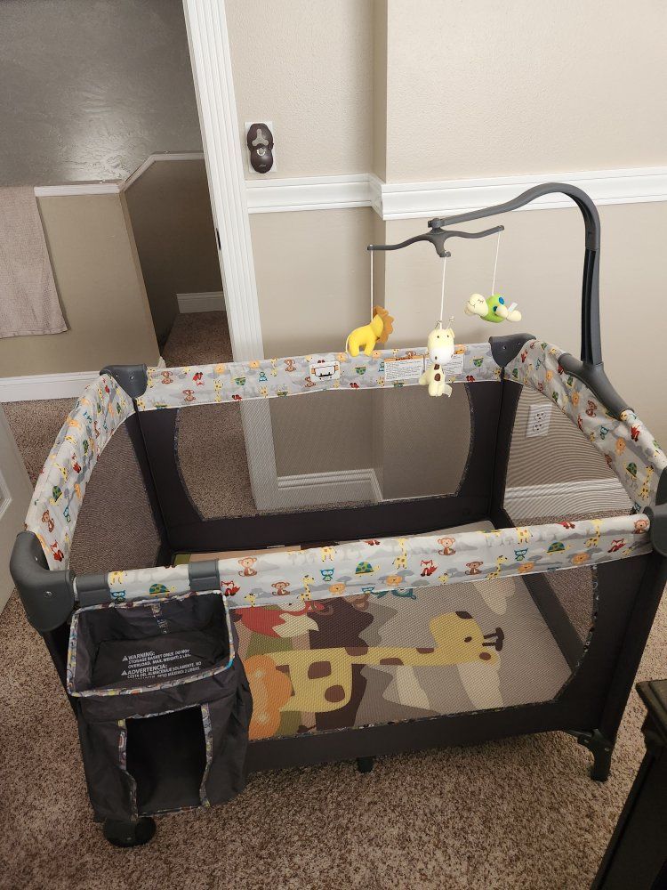 Baby Trend Playard with Mobile and Storage Caddy - Safari Animal Print