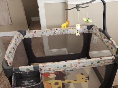 Baby Trend Playard with Mobile and Storage Caddy - Safari Animal Print