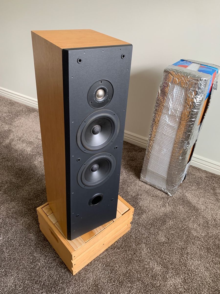 Two Polk standing speakers and center channel speaker
