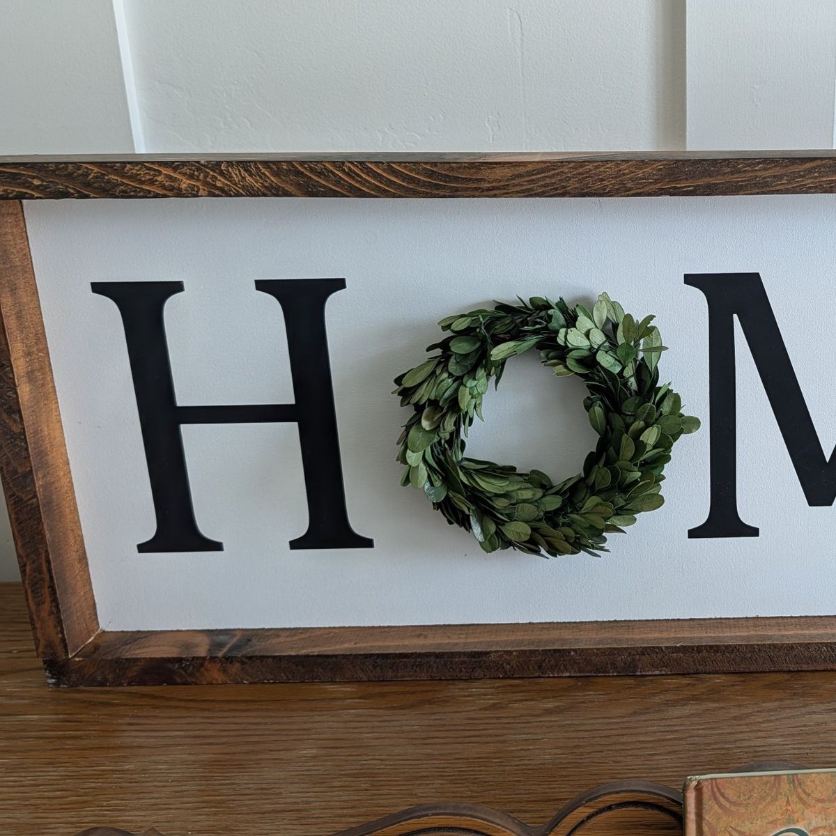 Wood framed, vinyl HOME sign
