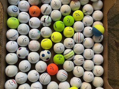 100 used golf balls