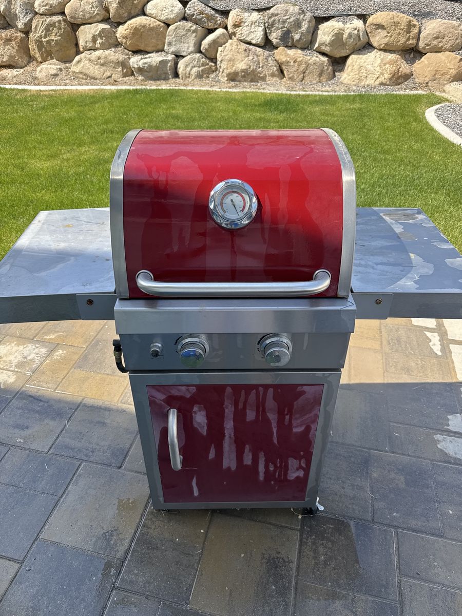 Compact Red Gas Grill with Side Tables - Perfect for Patios and Small Spaces