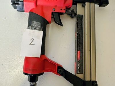 Nail Gun (KAKC9032) - 2-in-1 cordless 18-gauge brad nailer and stapler.