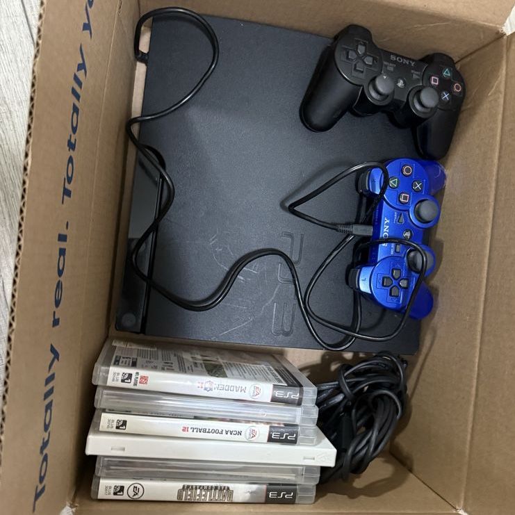 PlayStation 3 slim 320GB w/ games cables and controllers Included