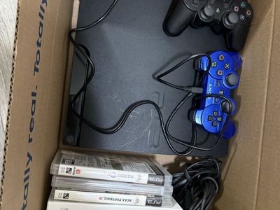 PlayStation 3 slim 320GB w/ games cables and controllers Included