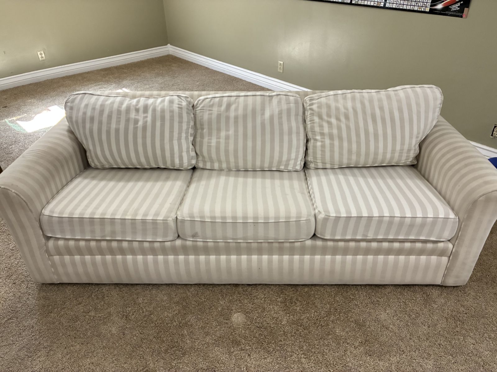 Traditional, three cushion sofa