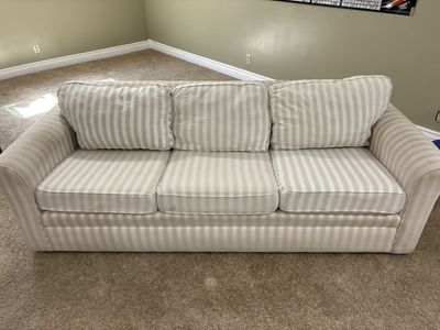 Traditional, three cushion sofa