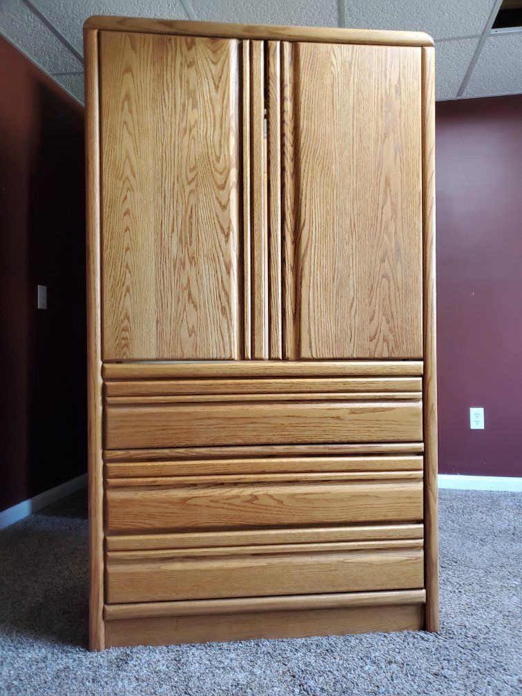Three drawer cabinet with hanging rod