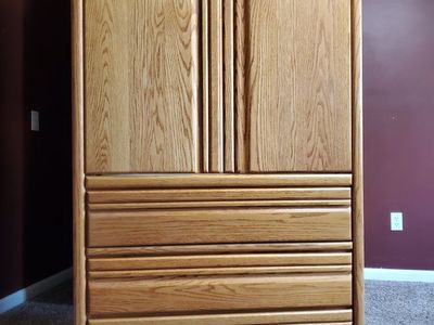 Three drawer cabinet with hanging rod