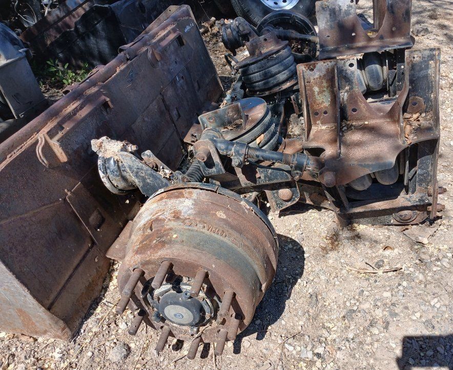 Tag axle for dump truck