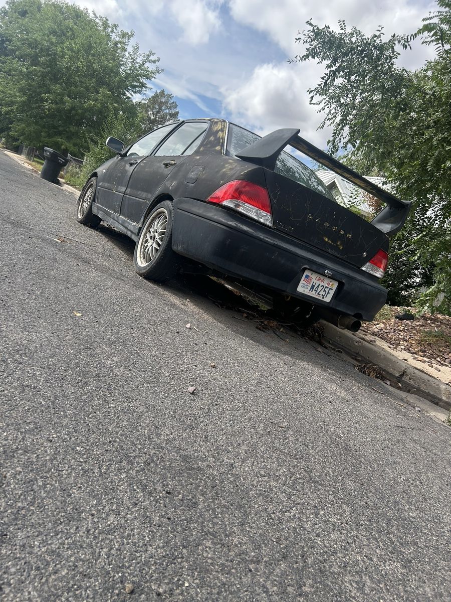 Mitsubishi Lancer Sedan - Project Car / running car just has a burnt clutch and a couple missing tubes for the engine 