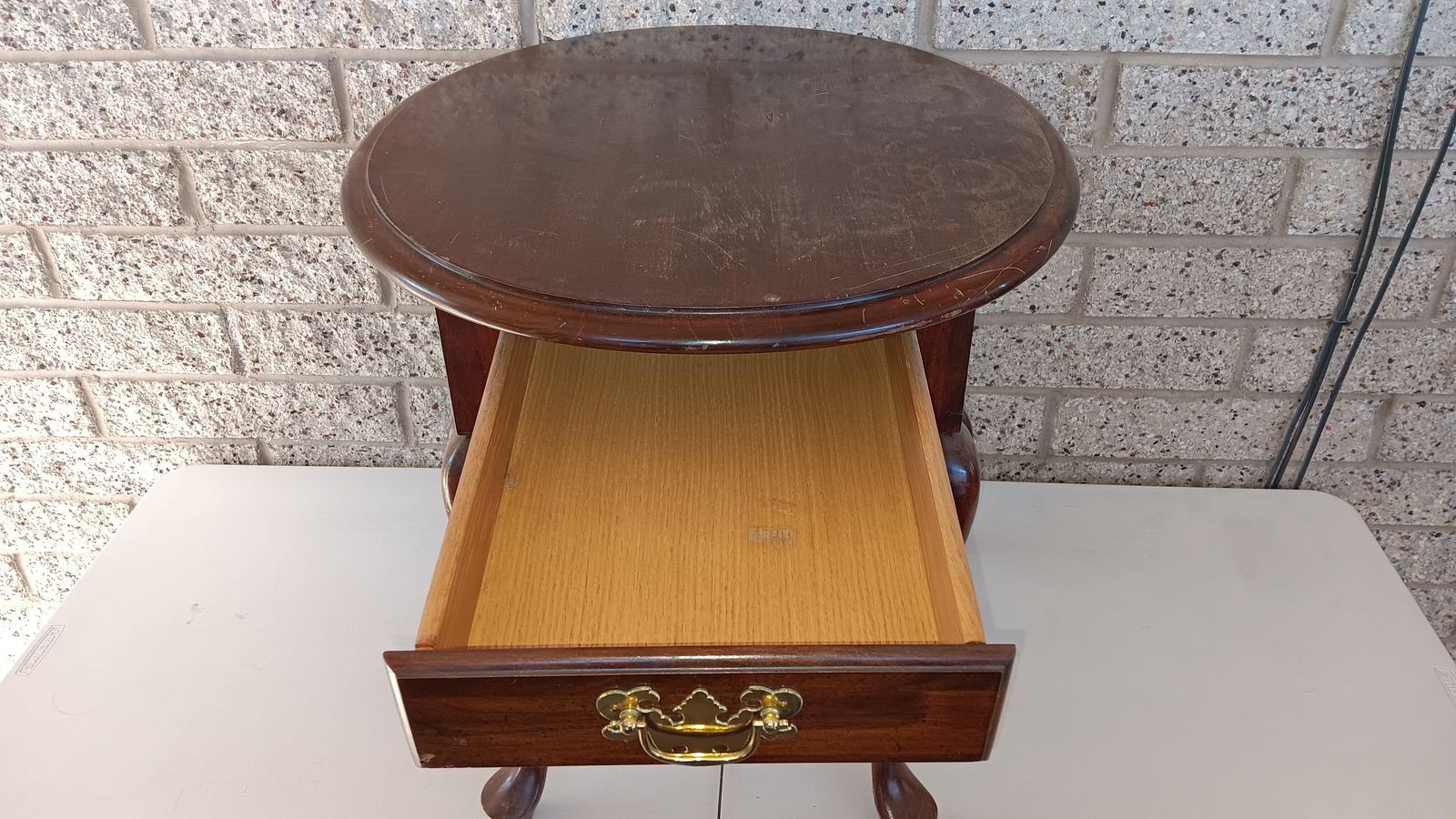 Solid wood small vintage oval shaped table with a drawer