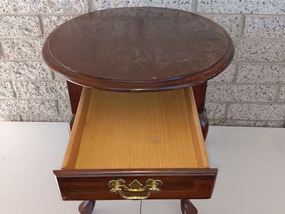 Solid wood small vintage oval shaped table with a drawer