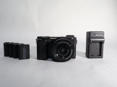 Sony Alpha a6300 Mirrorless Digital Camera with lens and 4 batteries