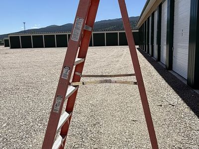 Werner 8 ft. Fiberglass Type IA 300 lb. Capacity & and a rolling Sheetrock cart