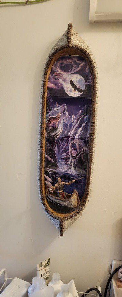 Canoe with 4 painted plates