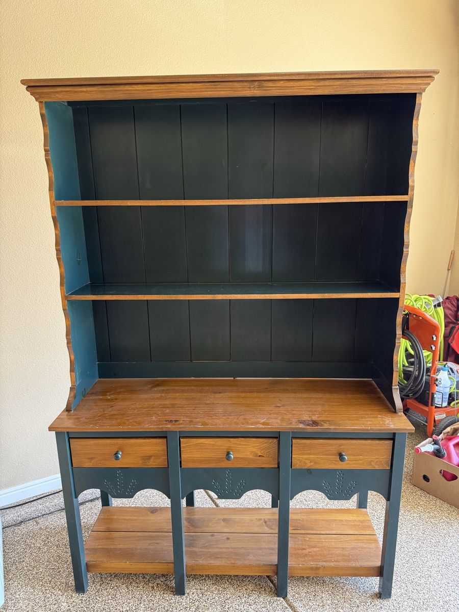 Storage cabinet with 2 drawers, and shelves.