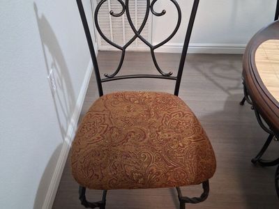 Round Dining Table with 4 Iron Chairs and covers with center decoration included.