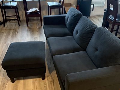 Black couch and ottoman with storage