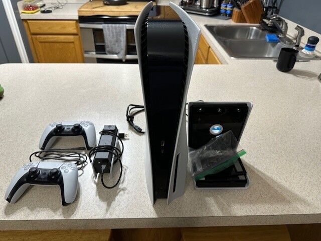 PS5 Disc Console with extra controller, 2 controller charger and wall mount
