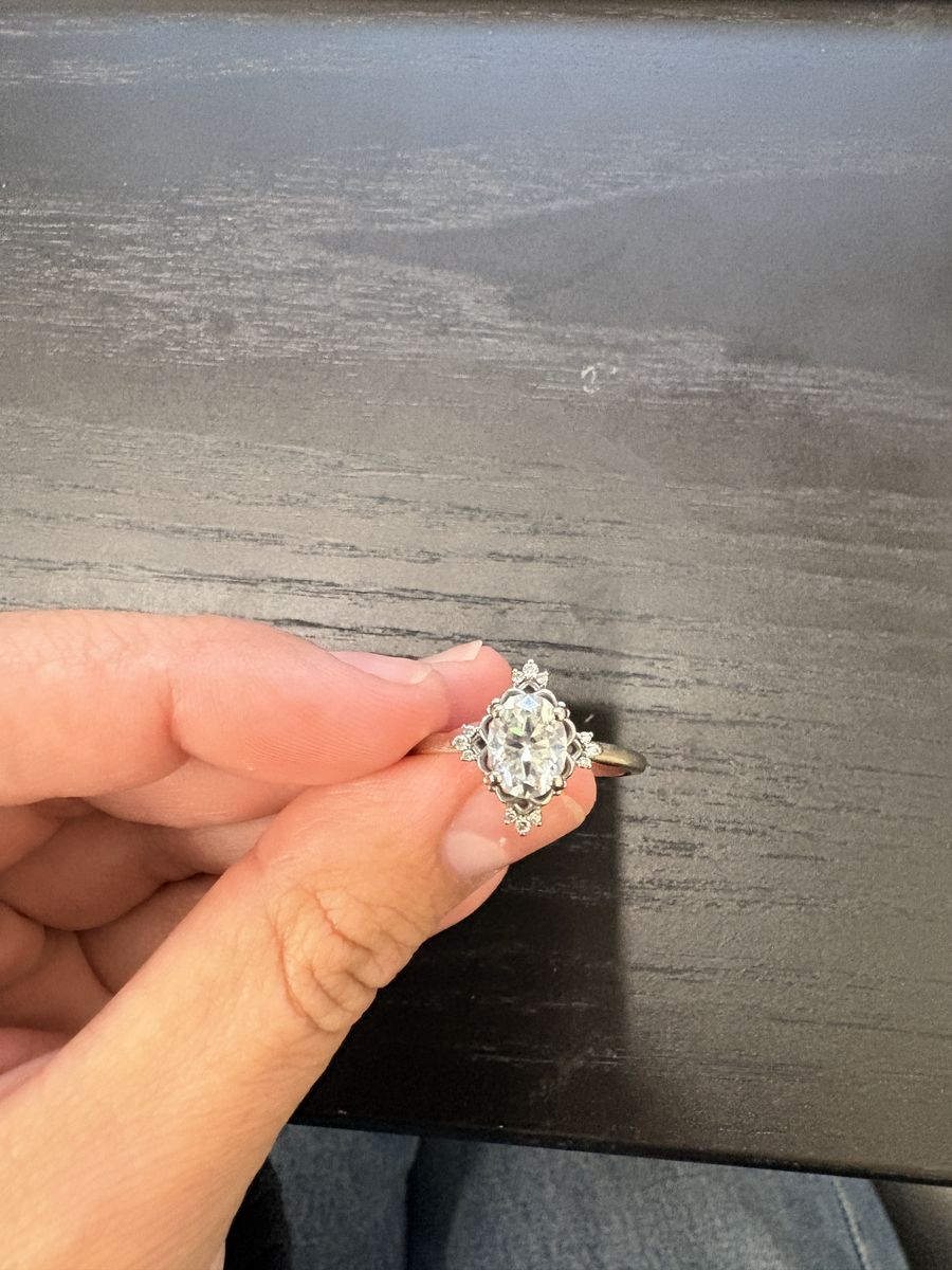 Moissanite white gold engagement ring with diamond edges