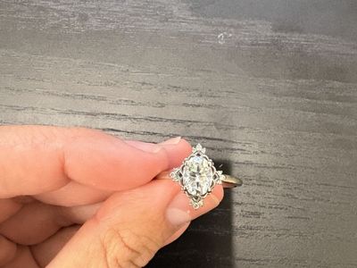 Moissanite white gold engagement ring with diamond edges