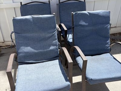 Set of 4 patio chairs with cushions.