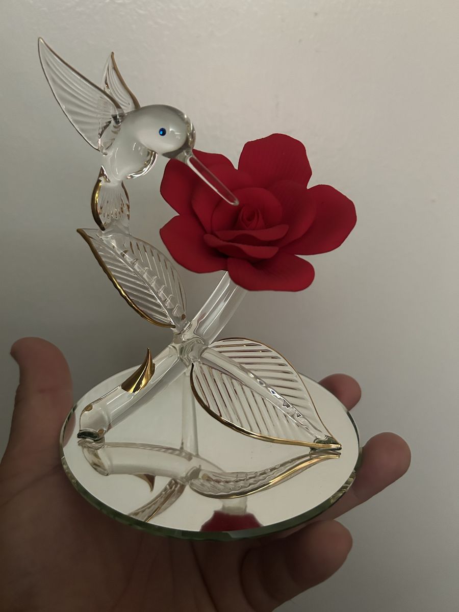 Glass hummingbird with red rose