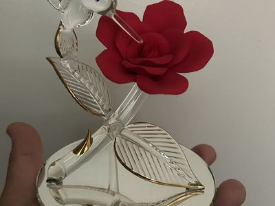 Glass hummingbird with red rose