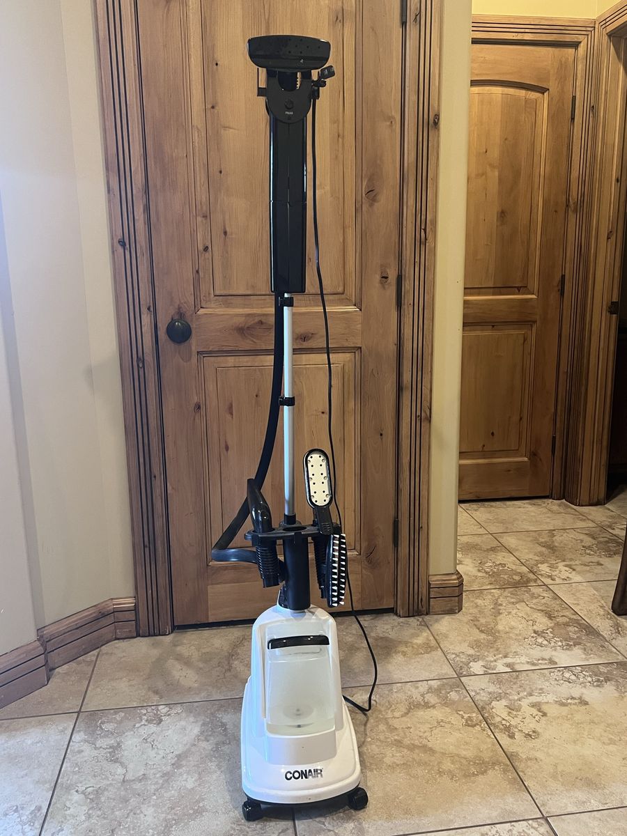 Conair portable steamer with accessory tools.