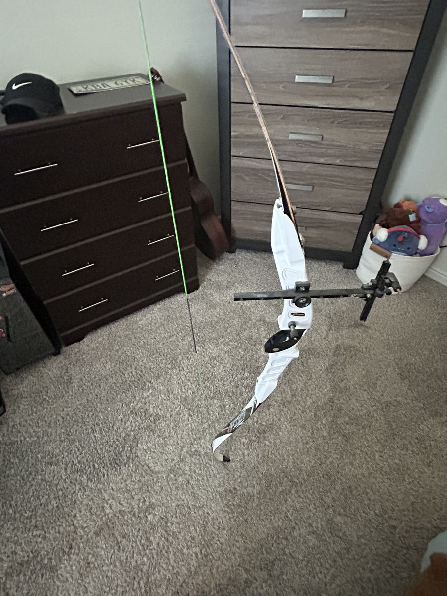 Recurve Bow with assorted arrows and sight attachment