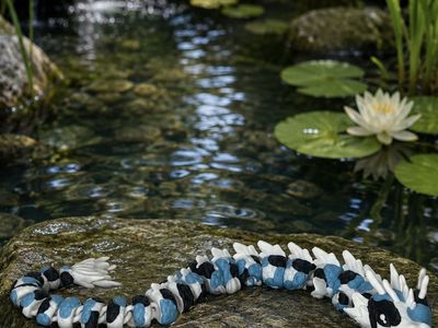 Articulated Koi Dragon Fidget Toy - Glow in the dark Blue, Black, and White