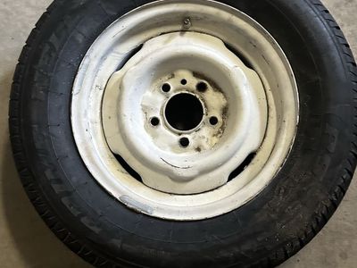 Single 195/70R14 Tire Mounted on White 5-Lug Steel Wheel Rim