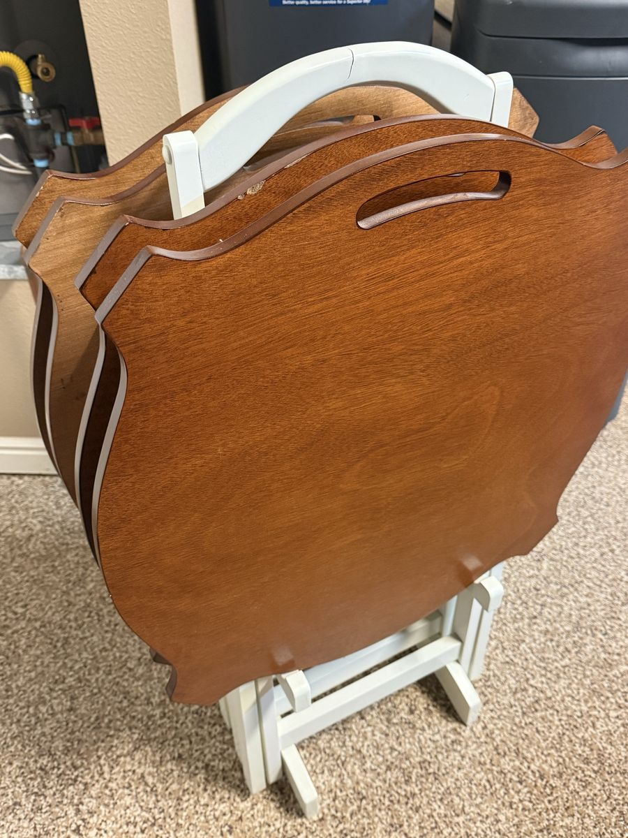 Four wooden TV trays. Very good condition.
