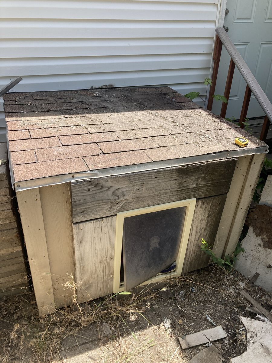 Wooden Dog House with Shingle Roof and Pet Door - Weather-Resistant Shelter for Your Furry Friend