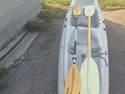 Tandem kayak with two paddles
