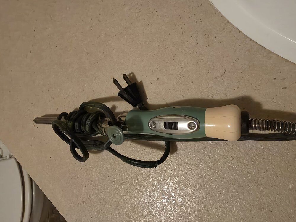 Antique curling iron