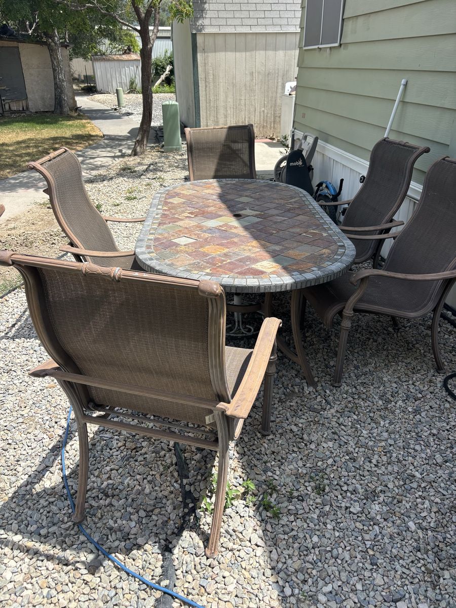 Ceramic tile top picnic table with 5 chairs . Very heavy and sturdy