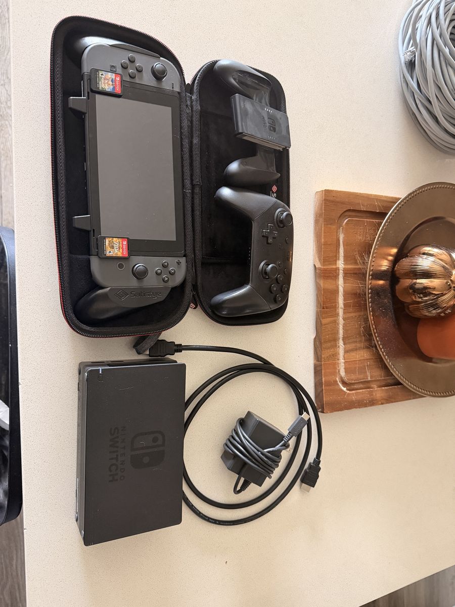 Nintendo Switch Console w/ Dock, Pro Controller, Case & Charger. Zelda Breath of the Wild and Pokémon Let’s Go Eevee included.