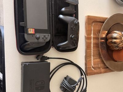 Nintendo Switch Console w/ Dock, Pro Controller, Case & Charger. Zelda Breath of the Wild and Pokémon Let’s Go Eevee included.
