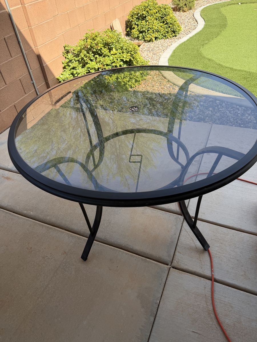 Outdoor glass table with umbrella