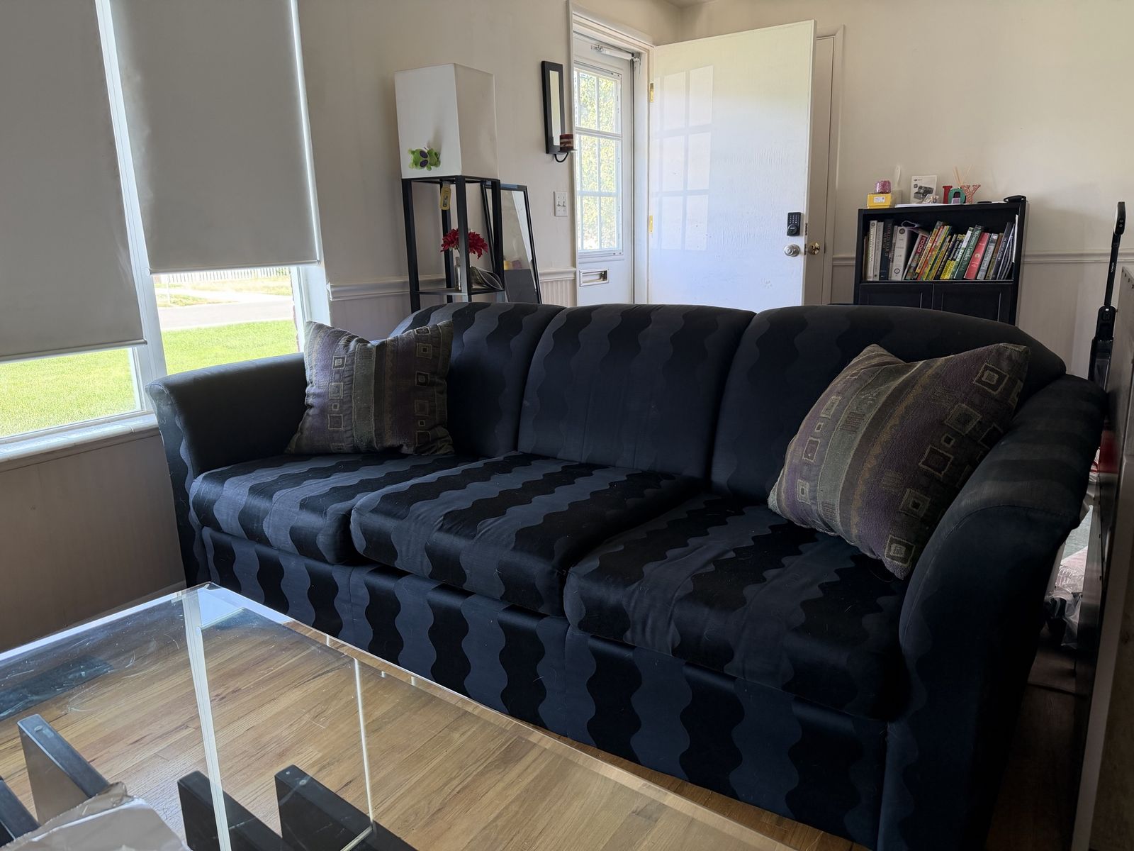 Black Fabric Three-Seat Couch with Patterned Cushions and Throw Pillows