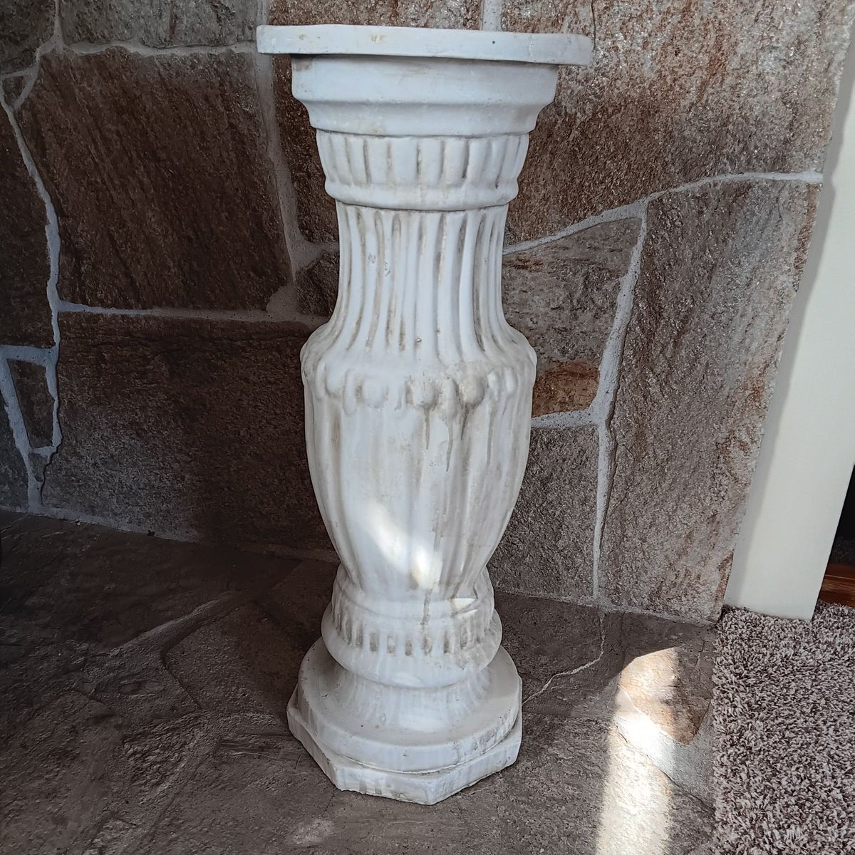 Statue or a flower pot pedestal.