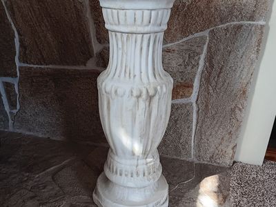 Statue or a flower pot pedestal.