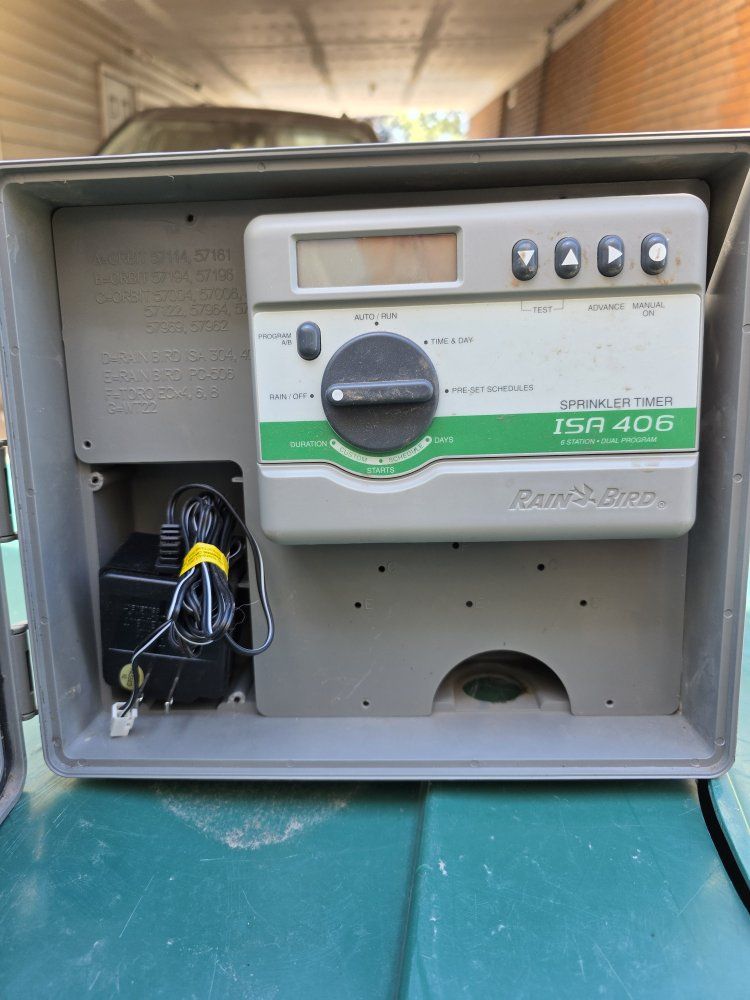 Sprinkler timer with enclosure