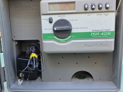 Sprinkler timer with enclosure